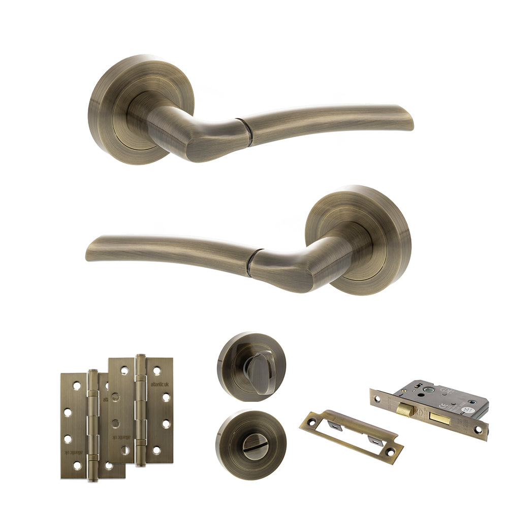 STATUS Indiana Door Handle Pack (Bathroom Set - 3" CE Bathroom Lock, 4" Slim Knuckle Hinges x2) - Antique Brass