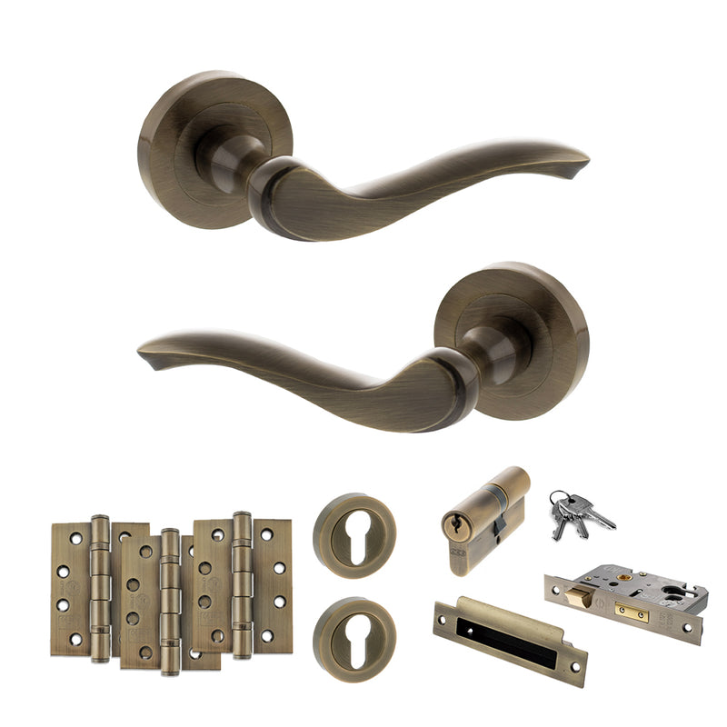 Old English Warwick Door Handle Pack (Euro Lock Set - 3" CE Sashlock, 4" Fire Rated Hinges x3) - Antique Brass