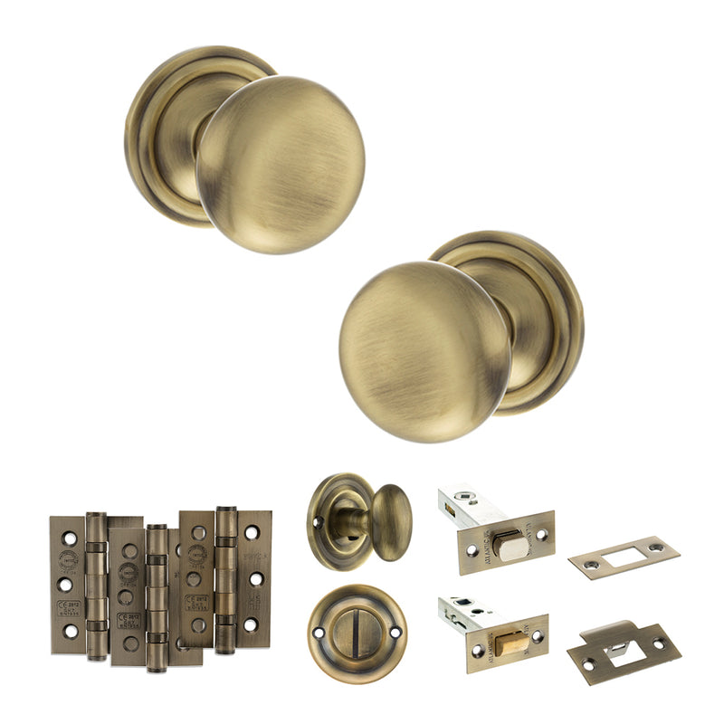 Old English Harrogate Door Knob Pack (Bathroom Set - 4" Deadbolt, 3" Fire Rated Hinges x3) - Antique Brass