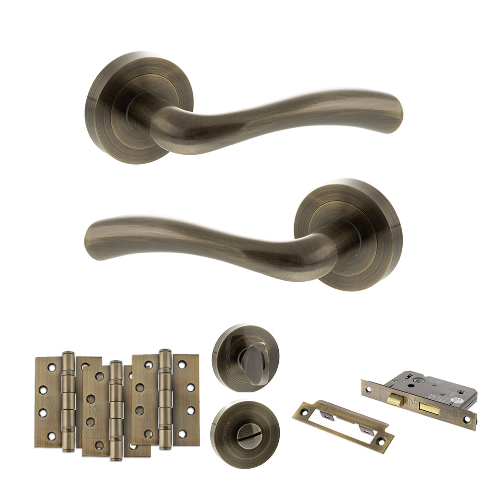 STATUS Texas Door Handle Pack (Bathroom Set - 3" CE Bathroom Lock, 4" Fire Rated Hinges x3) - Antique Brass