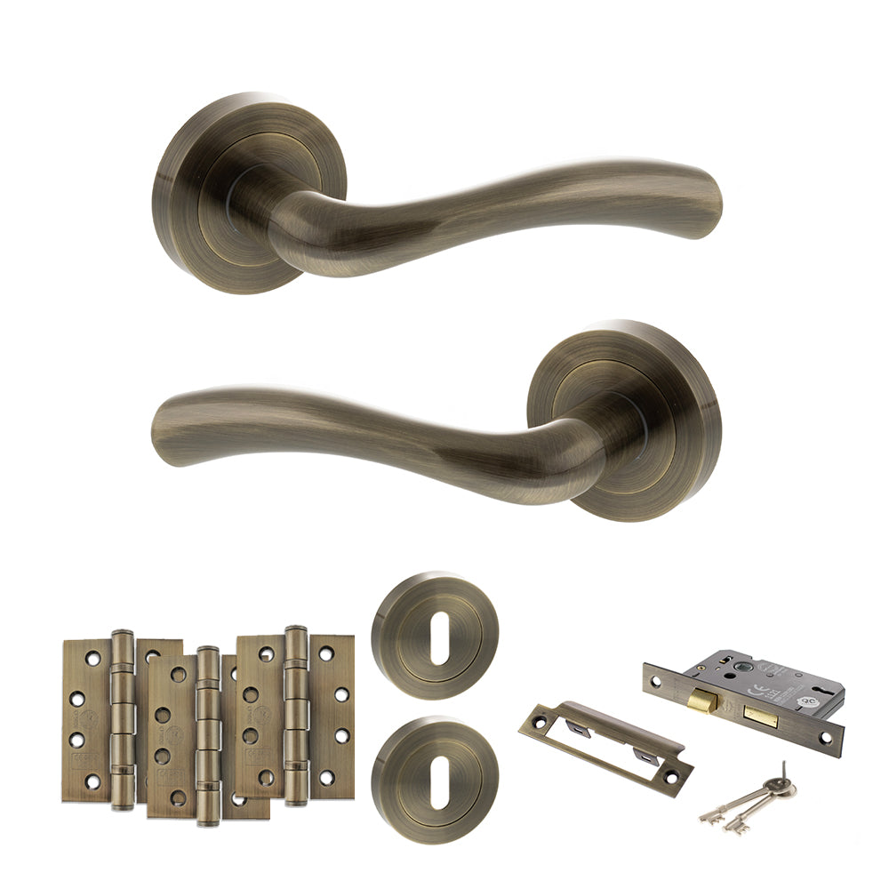 STATUS Texas Door Handle Pack (3 Lever Lock Set - 2.5" CE Sashlock, 4" Fire Rated Hinges x3) - Antique Brass