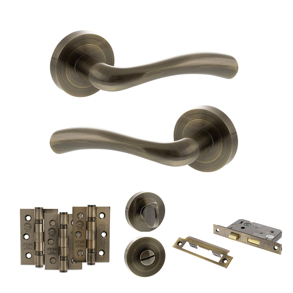 STATUS Texas Door Handle Pack (Bathroom Set - 2.5" CE Bathroom Lock, 3" Premium Hinges x3) - Antique Brass