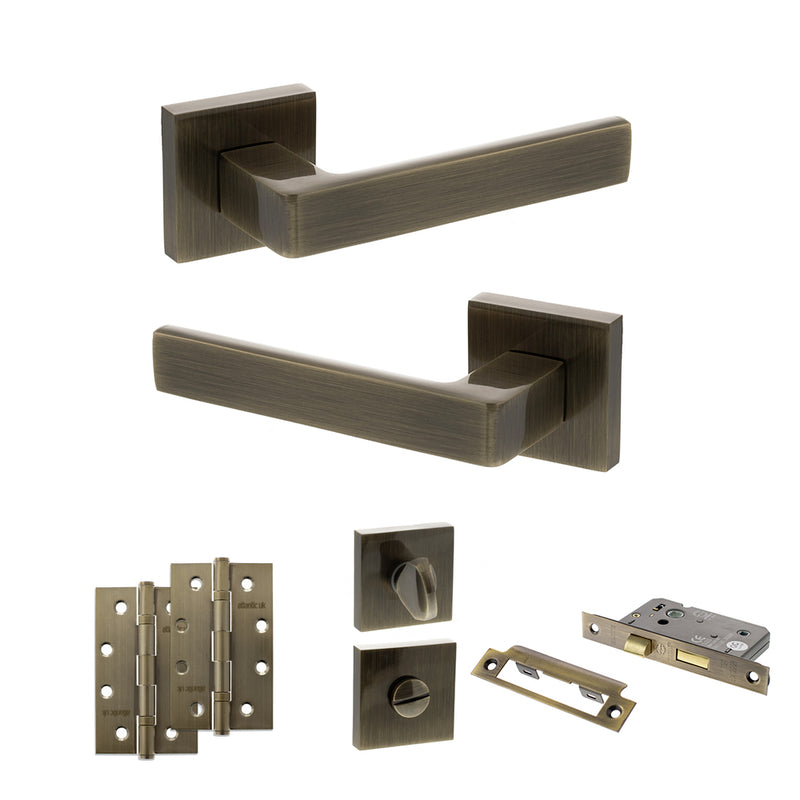 STATUS Montana Door Handle Pack (Bathroom Set - 3" CE Bathroom Lock, 4" Slim Knuckle Hinges x2) - Antique Brass