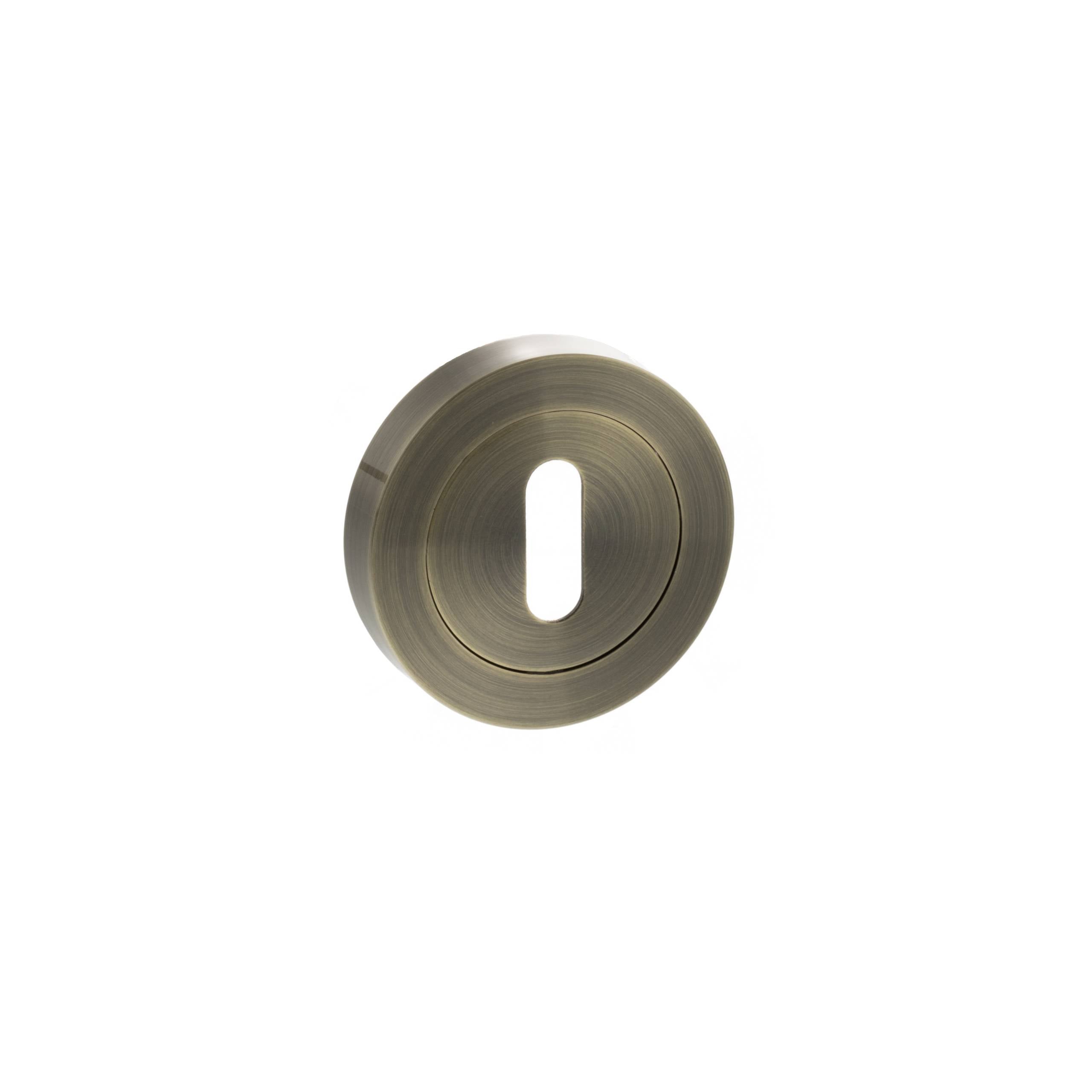 Atlantic STATUS Key Escutcheons on Round Rose - Antique Brass