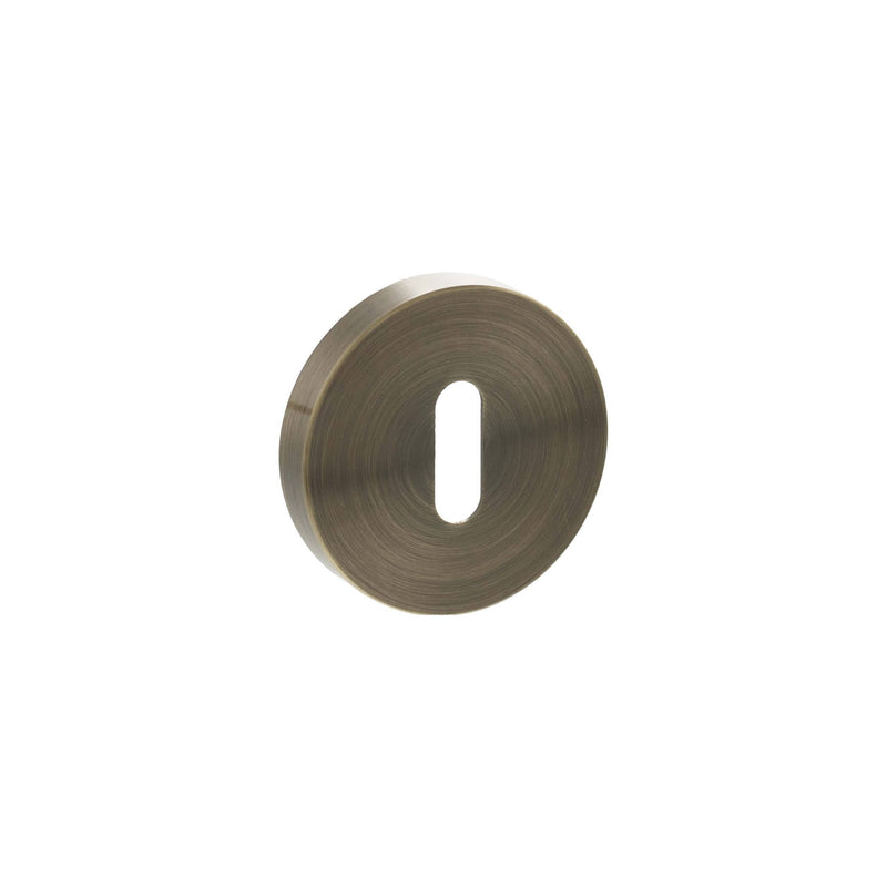 Atlantic Senza Pari Key Escutcheons on Minimal Round Rose - Antique Brass